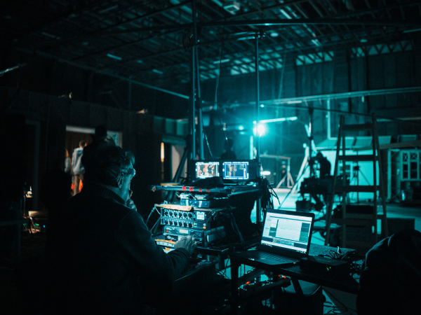 Technical production crew working behind the scenes