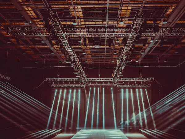 Event production team installing truss and technical equipment